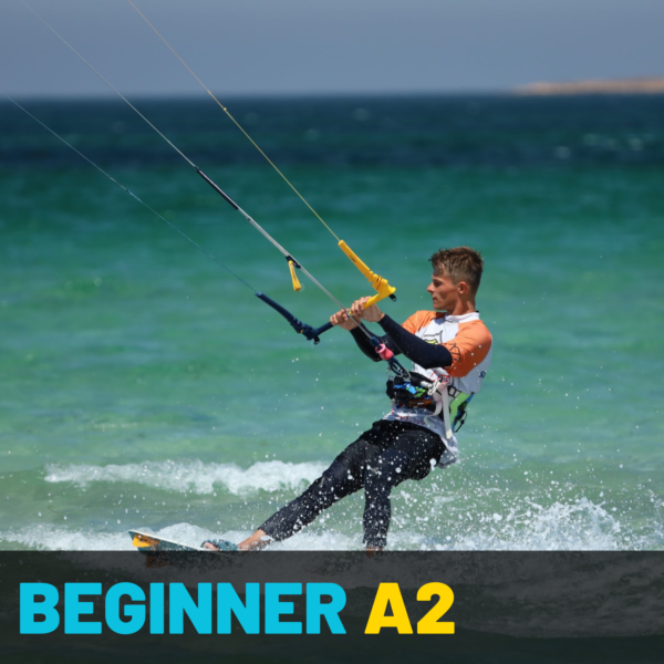 Kitesurfer improving body drag with a board and learning first waterstarts during the Beginner A2 course at 3C Zanzibar, ideal for those taking kitesurfing lessons in Paje, Zanzibar, and aiming to build foundational skills.